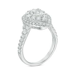 a white gold ring with diamonds on the sides and an oval center stone in the middle