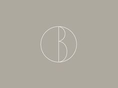 the letter b in a circle on a gray background