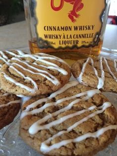 some cookies and a bottle of whiskey on a table