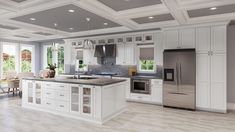 a large kitchen with white cabinets and an island