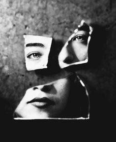 a woman's face is reflected in three mirrors, with the reflection of her eyes