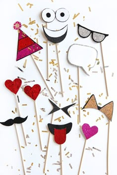 a group of cake toppers with different types of party hats and mustaches