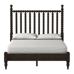 an image of a bed with white sheets and pillows on it's headboard