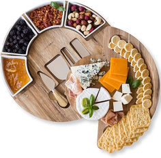 an assortment of cheeses and crackers on a platter