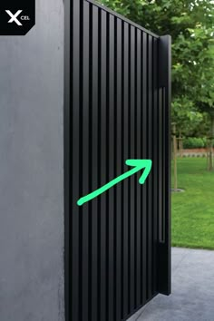 an arrow pointing to the left on a black gate