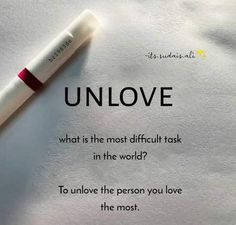 a pen sitting on top of a piece of paper with the words unlove written below it