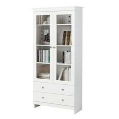 a white bookcase with two doors and drawers