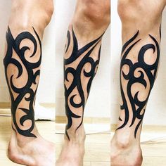 the legs and ankles of a man with black tattoos on their feet, both showing different designs