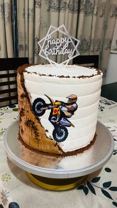 a birthday cake with a dirt bike on it