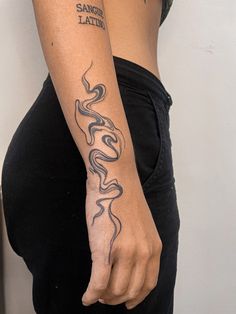 a woman with a tattoo on her arm