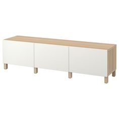 the sideboard is white and wood with two doors on one side, and three drawers on