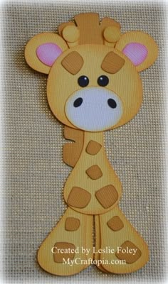 a close up of a stuffed animal on a cloth material background with the words, create your own giraffe