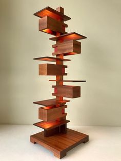 a sculpture made out of wooden blocks and lights