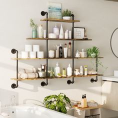 a bath room with a tub and shelves on the wall