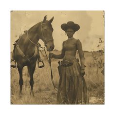 an old photo of a woman standing next to a horse in a field with tall grass