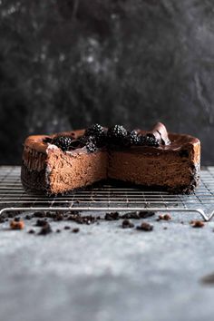 a piece of chocolate cake on a cooling rack