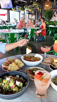 a table full of food and drinks at a restaurant