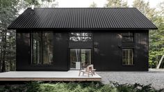 Appareil Architecture's black metal cabin hides in a Quebec forest Black Homes, Nordic Architecture, Black Cabin, Cedar Deck, Barn Houses, Black Barn, Metal Siding