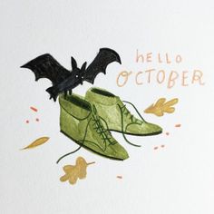 a pair of green shoes with bats on them and the words hello october written below