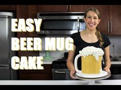 a woman holding a cake with beer mugs on it and the words easy beer mug cake