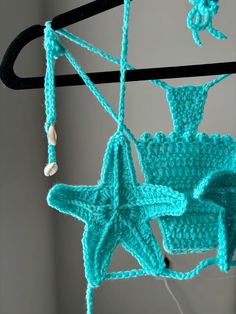 a crocheted starfish hanging from a hook