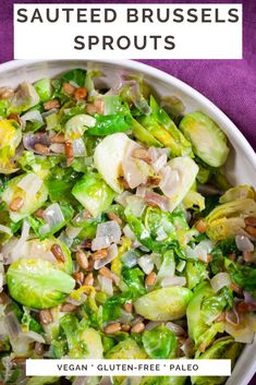 a white bowl filled with brussel sprouts and nuts