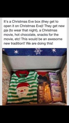 an open christmas gift box with pajamas and other items in it on carpeted floor