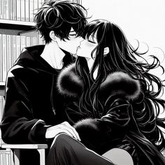 two people sitting next to each other in front of bookshelves and one is kissing the other