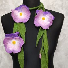 Felted wool necklace pansies made from soft merino wool and  fibers viscose and silk. The wool necklace is a 50-inch long stem. There are 2 flowers on one side and 1 flower on the other side of felt lariat. These flowers in purple with pink and white . The diameter of the flowers is 3.5 - 4  inches. This woolen jewelry can be worn on any clothing. Also, such a felt flower necklace can be an original gift for a woman More felt necklaces and scarves here: https://www.etsy.com/shop/EmbroideredFeltG Felt Flower Necklace, Wool Necklace, 2 Flowers, Felt Necklace, Necklace For Mom, Scarf For Women, Felt Flower, Felted Wool, Felt Flowers