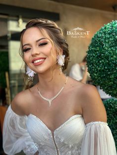 a woman in a wedding dress posing for the camera