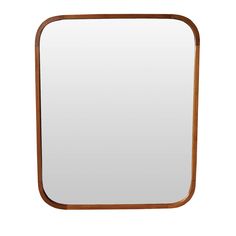 a wooden frame mirror sitting on top of a white wall