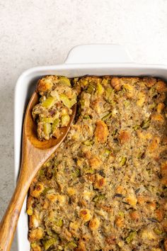 a casserole dish with a wooden spoon in it