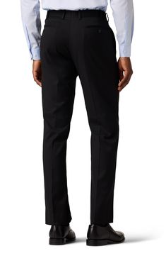 Dress to impress in these polished and practical trousers tailored from wrinkle-resistant performance fabric. 32" inseam; 15.75" leg opening; 10.125" rise (size 32x32) Zip fly with hook-and-bar closure Jetted pockets Lined Polyester/rayon blend with 2% spandex
 Dry clean Imported Tailored Business Pants With Belt Loops, Business Straight Leg Elastane Pants, Business Casual Slim Fit Elastane Bottoms, Black Stretch Pants For Business, Tailored Straight Leg Elastane Work Pants, Tailored Business Casual Pants With Straight Hem, Tailored Straight Leg Work Pants In Elastane, Tailored Dress Pants With Belt Loops For Business, Fitted Work Pants With Welt Pockets