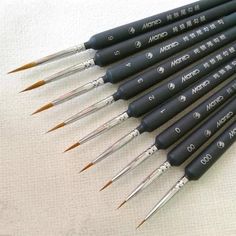 six different types of paint brushes lined up in a row on top of each other