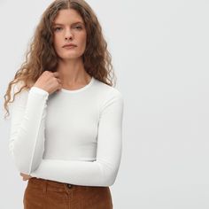 Meet your new favorite layer. Featuring a classic crew neckline, long fitted sleeves, and a snug fit throughout, the Pima Micro-Rib Long-Sleeve Crew is a go-to cold-weather essential. The best part? It’s made of our lightweight, fine-ribbed cotton with a touch of stretch that hugs in all the right places. Wear it on its own indoors, or layer it under your favorite sweater for added warmth all season long. Classic Crew Neck Long Sleeve Top For Spring, Fitted Fine Knit Long Sleeve Crew Neck Top, Fitted Long Sleeve Crew Neck Top For Layering, Fitted Long Sleeve Top With Crew Neck, Classic Stretch Long Sleeve Top With Crew Neck, Everlane Crew Neck Top For Spring, Fitted Long Sleeve Top With Ribbed Crew Neck, Fitted Crew Neck Top With Ribbed Cuffs, Everlane Long Sleeve Cotton Tops