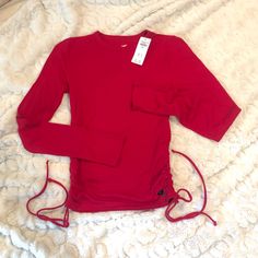 Nwt Hollister Women’s Long Sleeve Tee Shirt In Red. Drawstring Sides. Size Small. Fitted Red Cotton Tops, Trendy Stretch Red Tops, Trendy Red Stretch Tops, Red Stretch Tops For Spring, Stretch Red Tops For Spring, Stretch Red Top For Spring, Red Fitted Long Sleeve Top, Red Stretch Crew Neck Shirt, Red Crew Neck Top For Spring