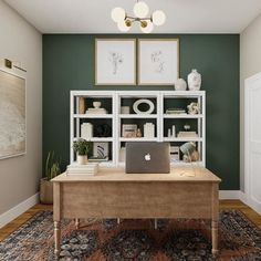 a laptop computer sitting on top of a wooden desk in front of a bookshelf