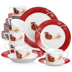 a red and white christmas dinner set with santa sleigh design on it's side