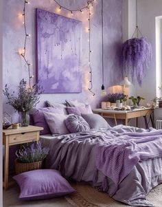 a bedroom decorated in purple and lavender tones