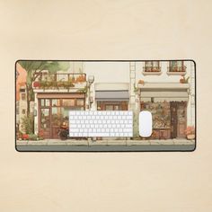 a computer mouse pad with a drawing of a storefront and a keyboard on it