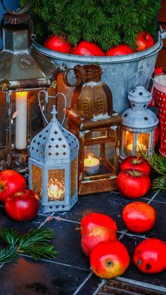 apples and candles are sitting on the table