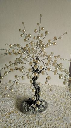 a tree made out of pearls on a table