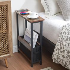 a bed with a wooden side table next to it