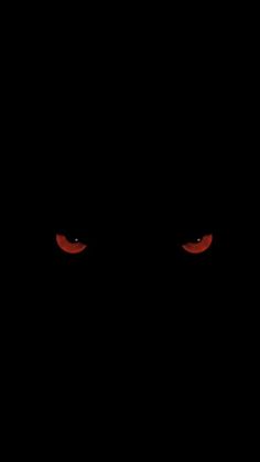 red eyes in the dark on a black background