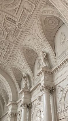 an ornate ceiling in a building with columns