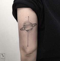 an arm with a saturn tattoo on it