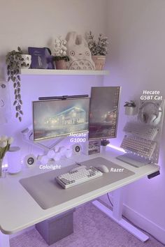 a desk with two computer monitors and a keyboard on it, all lit up by purple lighting