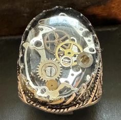 Discover our men's steampunk ring, a bold handcrafted piece that combines rugged style with vintage charm. This unique ring features intricate gear motifs and industrial details that embody the essence of steampunk aesthetics. Perfect for the modern man who values individuality, it's an ideal statement accessory for both casual and formal occasions. Elevate your style with this exceptional ring that adds a touch of creativity and character to your look Steampunk Ring, Steampunk Rings, Vintage Inspired Jewelry, Rugged Style, Unique Ring, Inspired Jewelry, Modern Man, Vintage Charms, Rings Statement