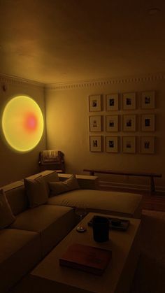 a living room filled with furniture and a yellow light in the middle of the room