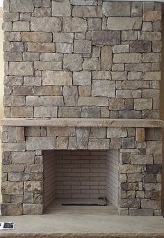 a large stone fireplace in a living room